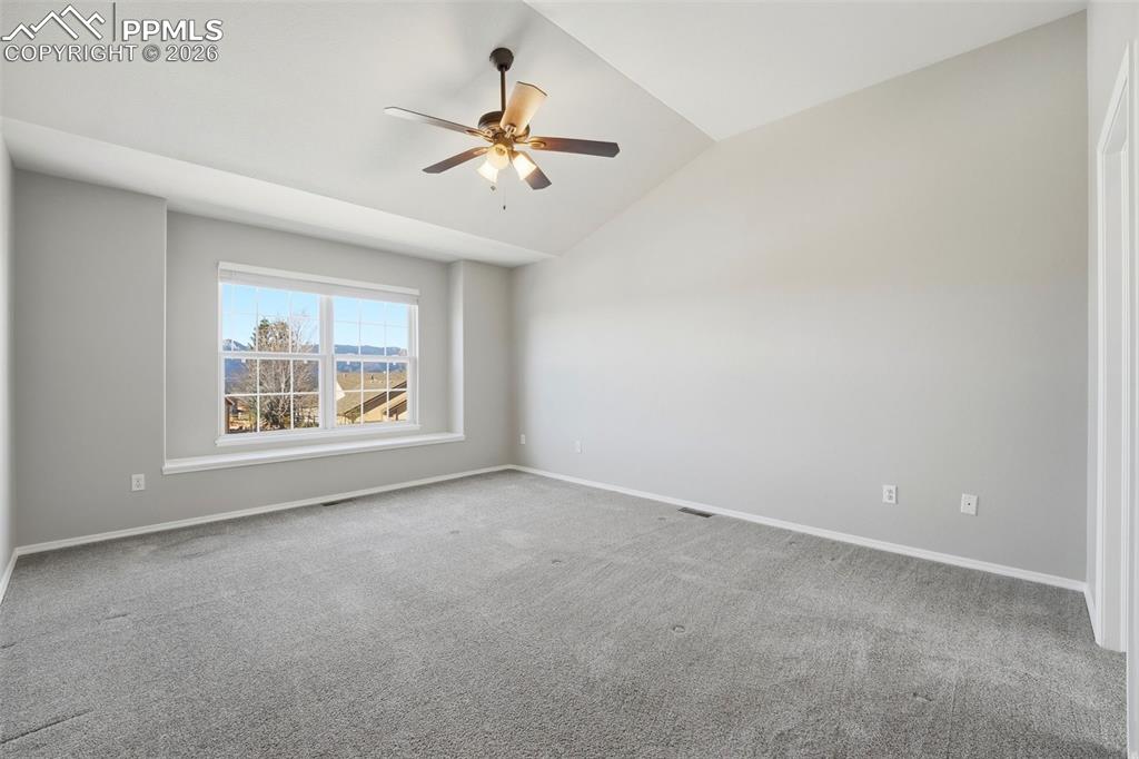 Image 22 of 49: Large cozy primary retreat with 5pc bath and walk-in closet