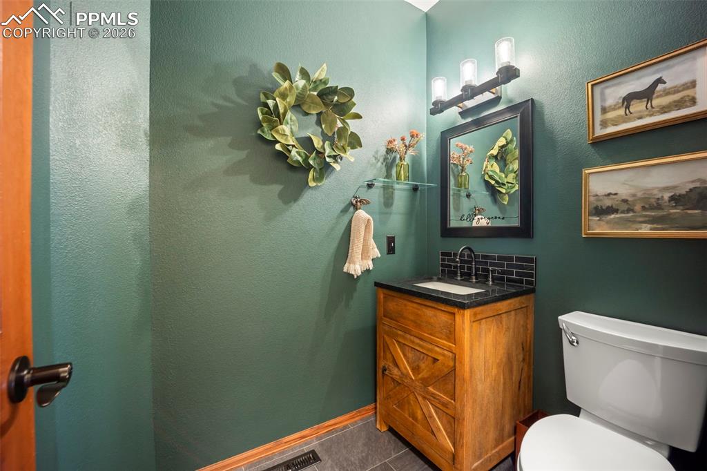 Image 18 of 48: Bathroom featuring vanity and toilet