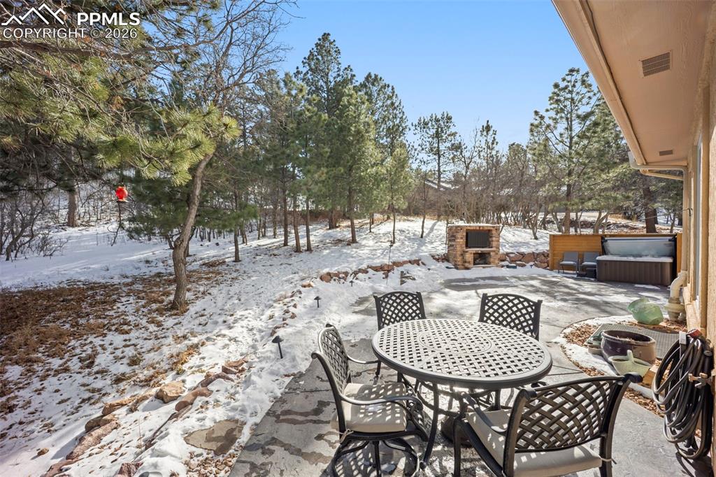 Image 37 of 48: Spacious patio featuring a patio area and outdoor dining space