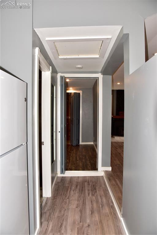 Image 21 of 46: Hallway featuring wood finished floors
