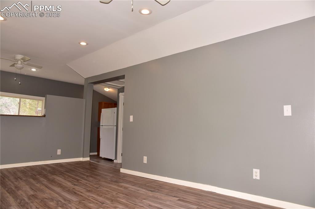 Image 6 of 46: Empty room with ceiling fan, recessed lighting, dark wood-type flooring, an