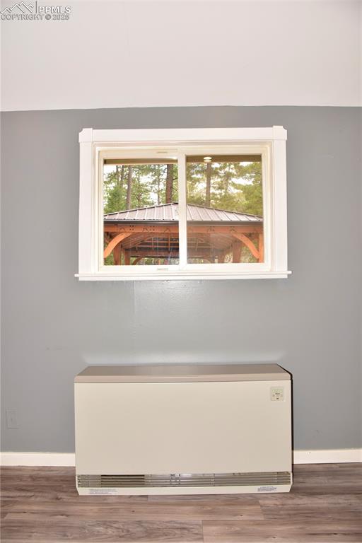 Image 8 of 46: Detailed view of baseboards and wood finished floors