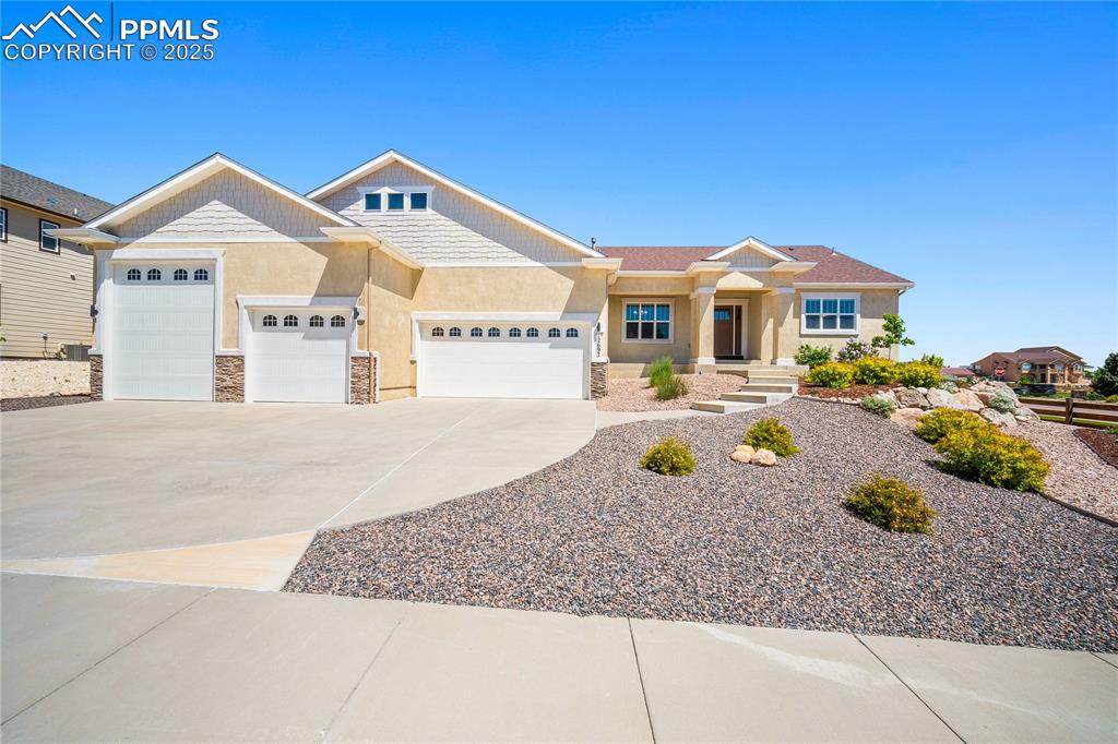 Caption: The home sits on a large corner lot that has been meticulously maintained. Huge garage with RV parki