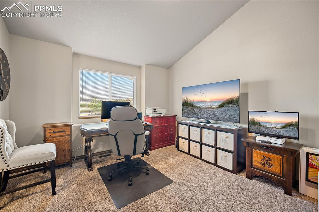 Image 20 of 50: Main level bedroom #2, currenlty being used as an office. Attatched Jack-n-