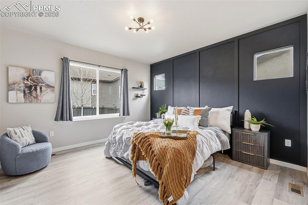 Image 11 of 47: Large master bedroom with tall ceilings