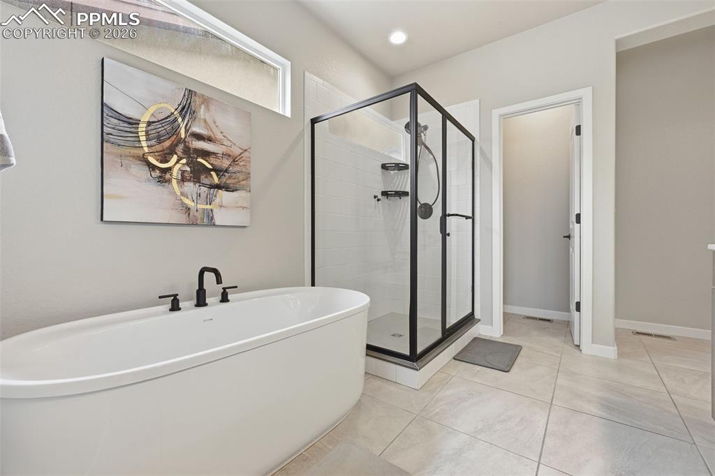 Image 13 of 47: 5-piece master bath with freestanding tub and shower