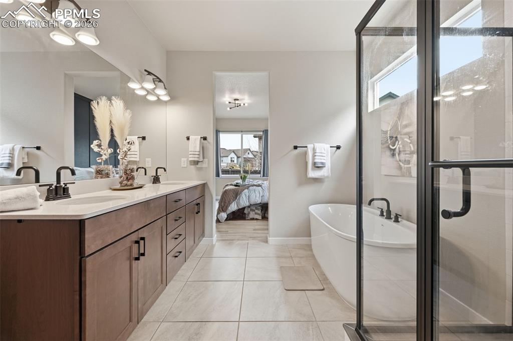 Image 14 of 47: Large master bath room with updated finishes