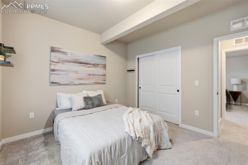 Image 28 of 47: Basement bedroom 2 with lots of natural light