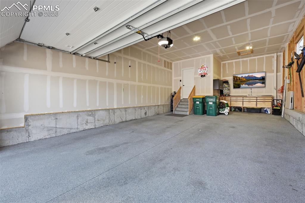 Image 35 of 47: Work bench and storage cabinets included