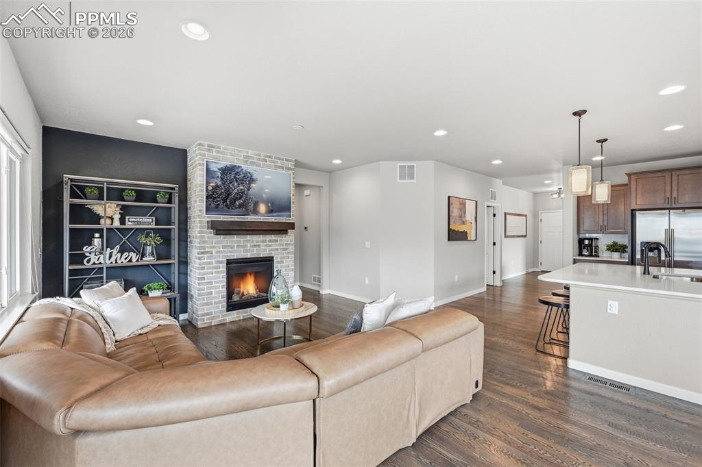 Image 9 of 47: Open floor plan to kitchen