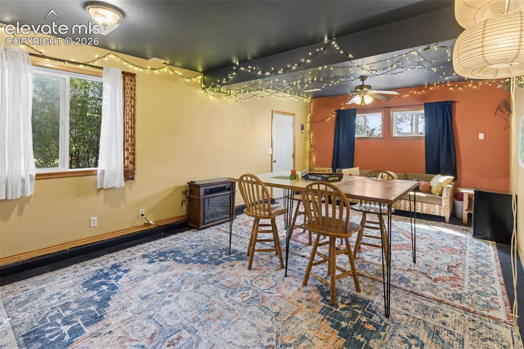 Image 33 of 50: Recessed ceiling lighting, ceiling-mounted fan, multiple windows