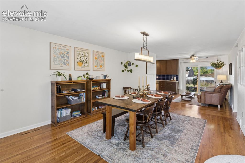 Image 9 of 50: Hardwood flooring throughout, recessed lighting, and a modern ceiling fan