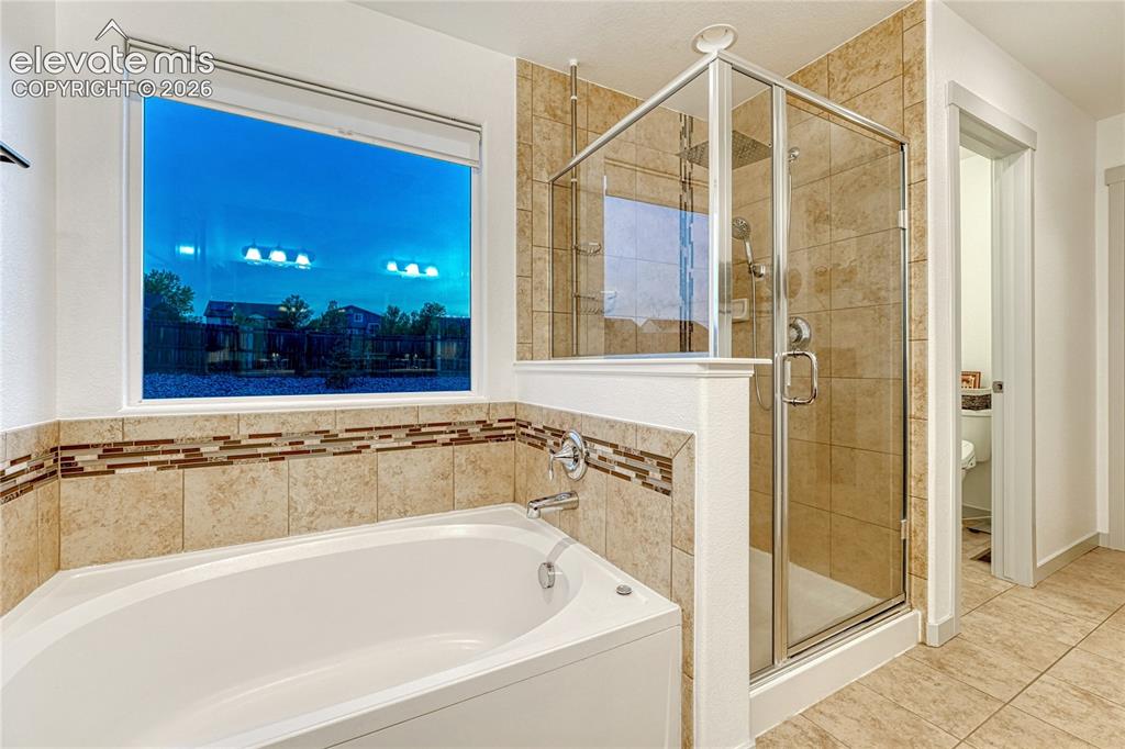 Image 18 of 38: Primary Tub & Shower