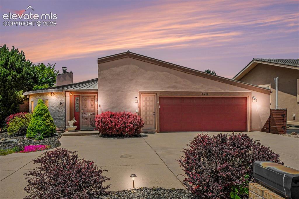 Image 1 of 31: Desirable and rare Country Club custom home Stucco exterior with a partial 