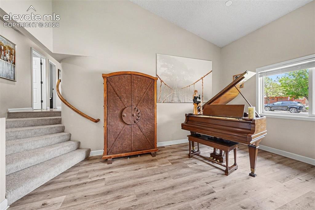 Image 5 of 31: Custom home with gorgeous rounded wall features and multipurpose nooks. 