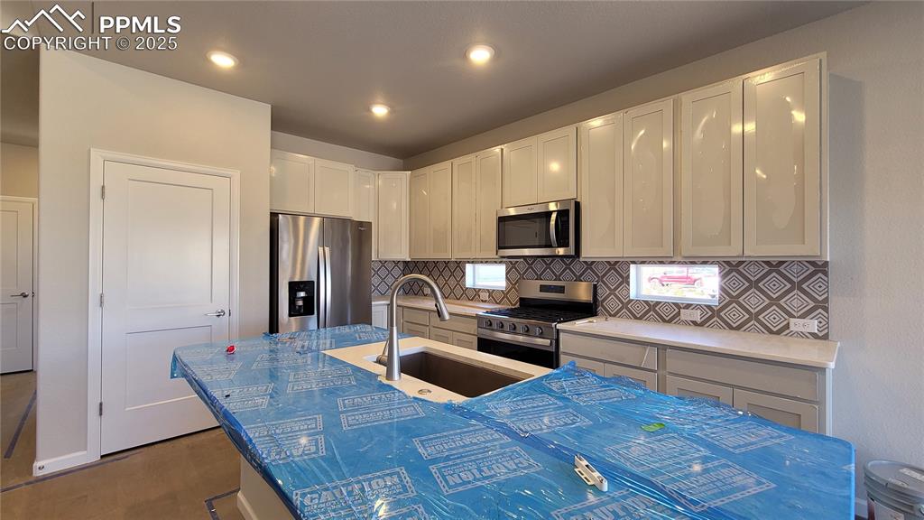 Image 10 of 36: Composite Single Bowl Sink in Kitchen Island! Please, excuse our dust as th