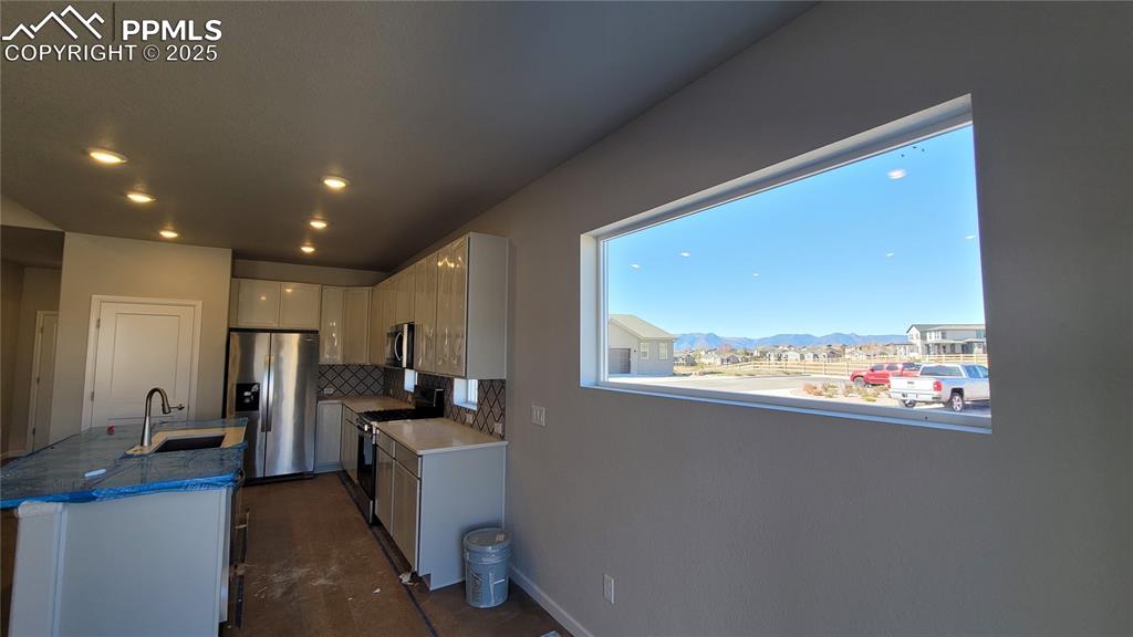 Image 13 of 36: Abundance of natural light through the large window! Please, excuse our dus