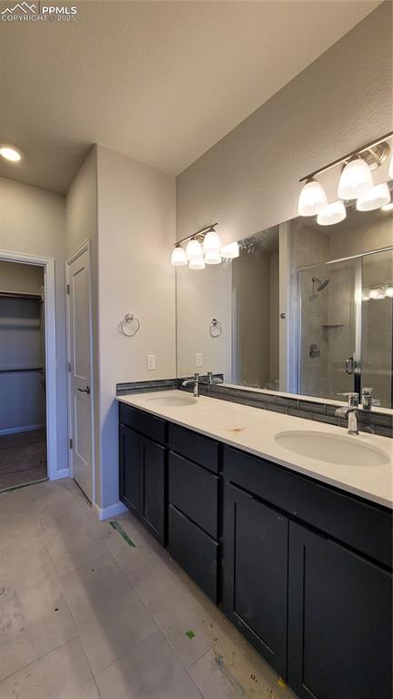 Image 18 of 36: Primary Bathroom with double vanities and linen closet! Please, excuse our