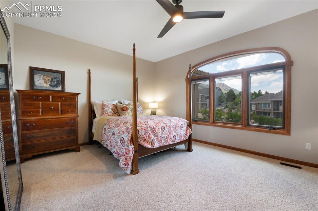 Image 24 of 50: Main Level Bedroom With Mountain Views