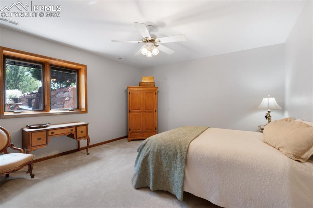 Image 36 of 50: Garden Level Window In Bedroom 4 Looks Out To Sitting Area...
