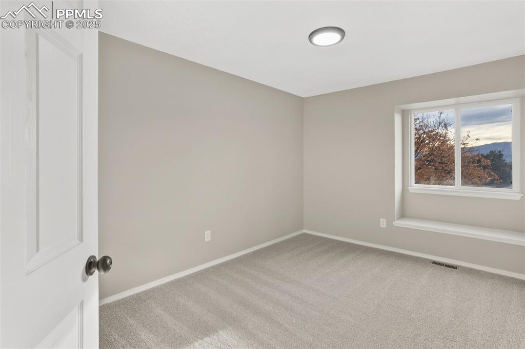 Image 24 of 32: 1 of 4 upper lever bedrooms