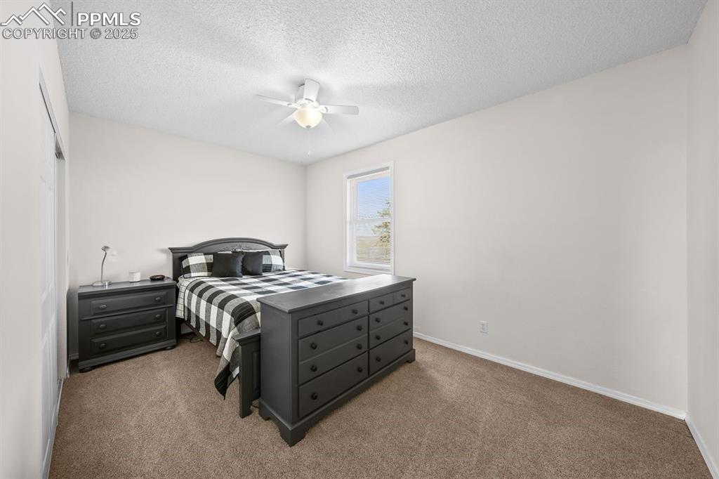 Image 24 of 39: Bedroom featuring carpet and a ceiling fan