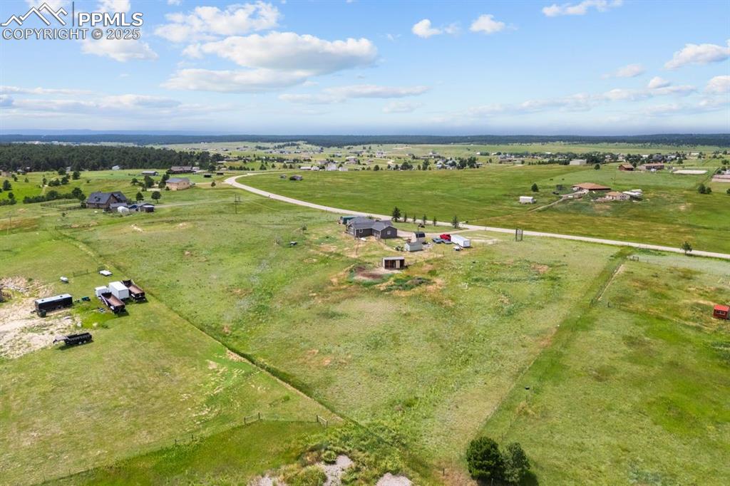 Image 39 of 39: Aerial view of sparsely populated area featuring a pastoral area