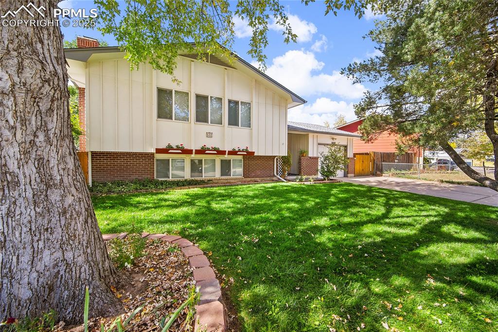 Image 3 of 48: Mature trees and landscaping. 