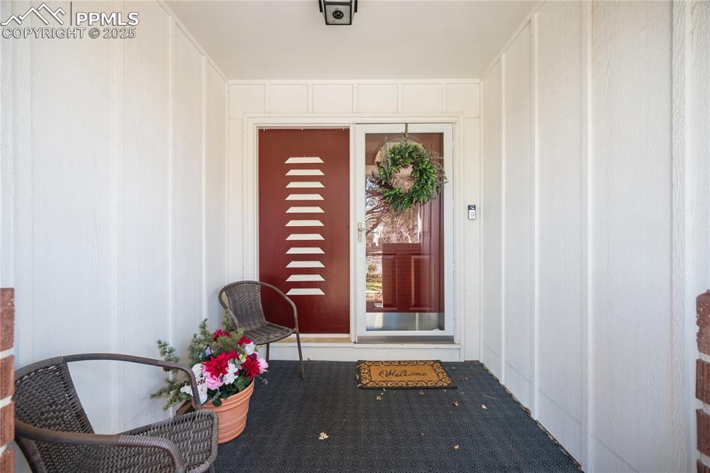 Image 4 of 48: Welcoming covered front porch greets friends and family. 