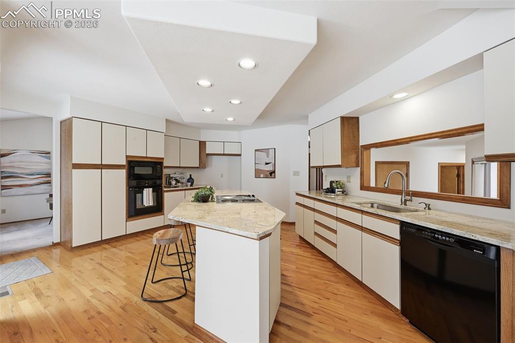 Image 11 of 45: Upgraded countertops and real wood floors!