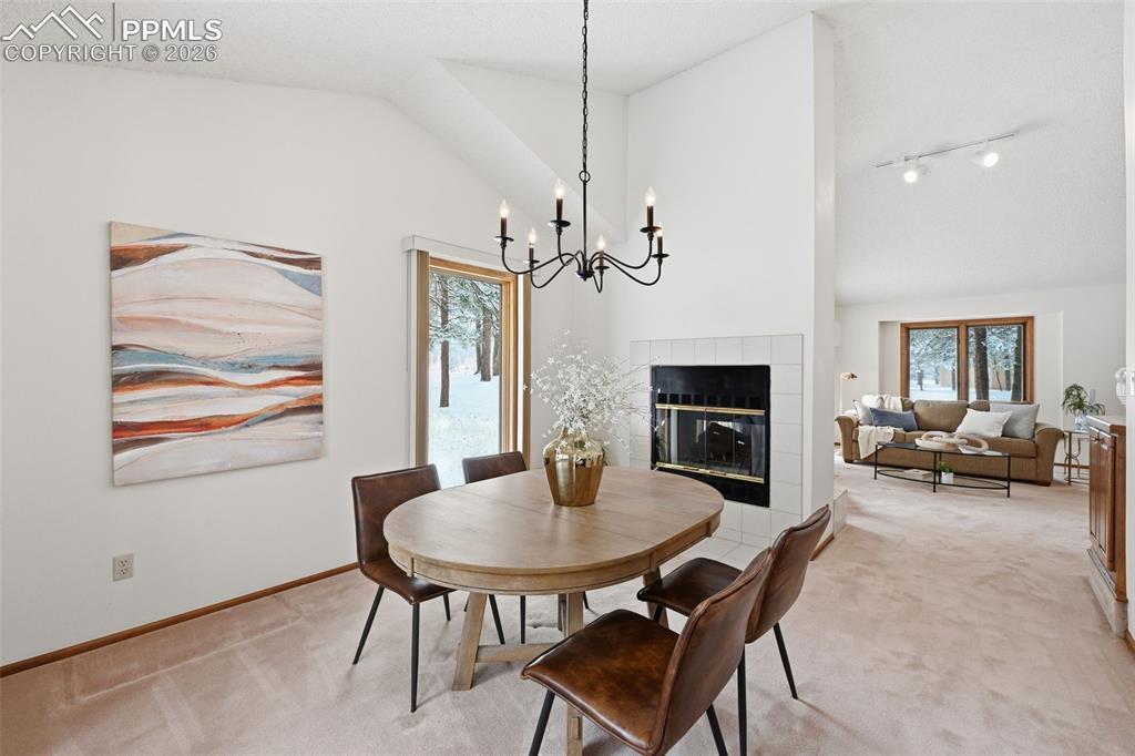 Image 13 of 45: Large dining room with gas fireplace and new lighting!
