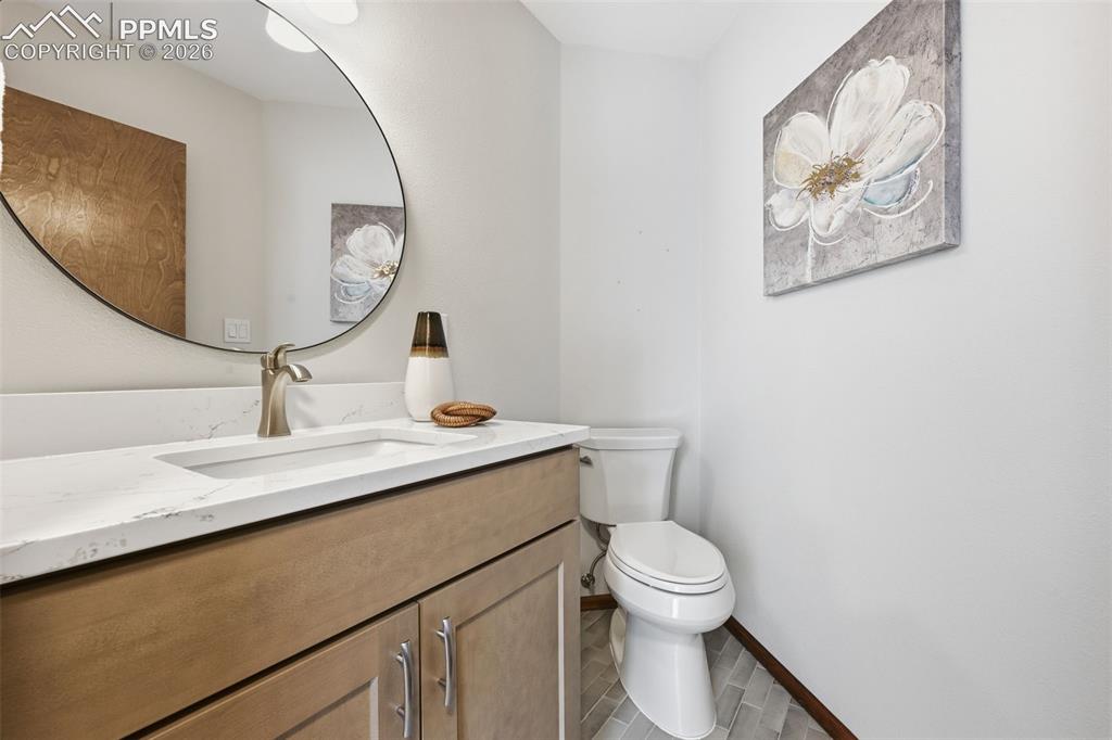 Image 21 of 45: Updated half bath on the main floor!