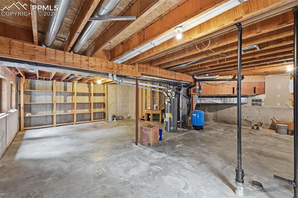 Image 36 of 45: Another view of the unfinished basement