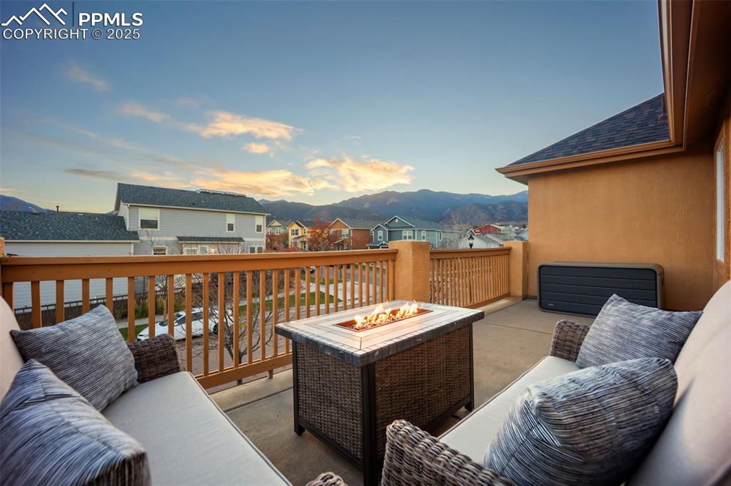 Image 27 of 50: Deck with a residential view and outdoor lounge area