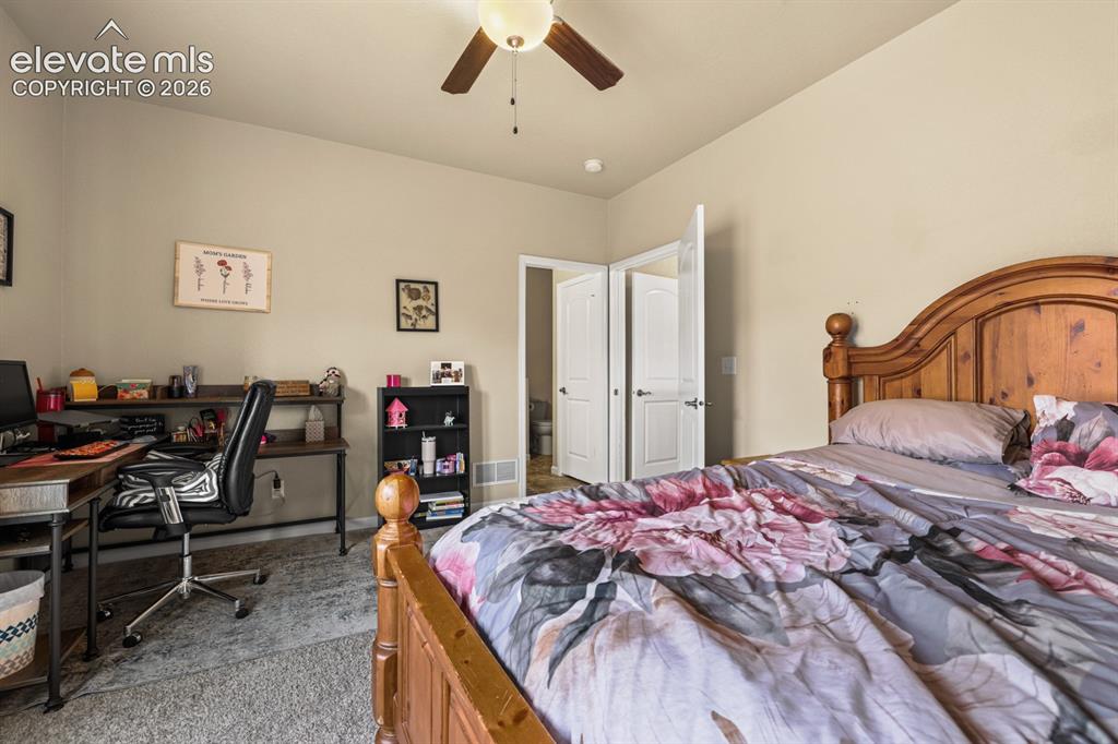 Image 16 of 38: Main Level Primary Bedroom.