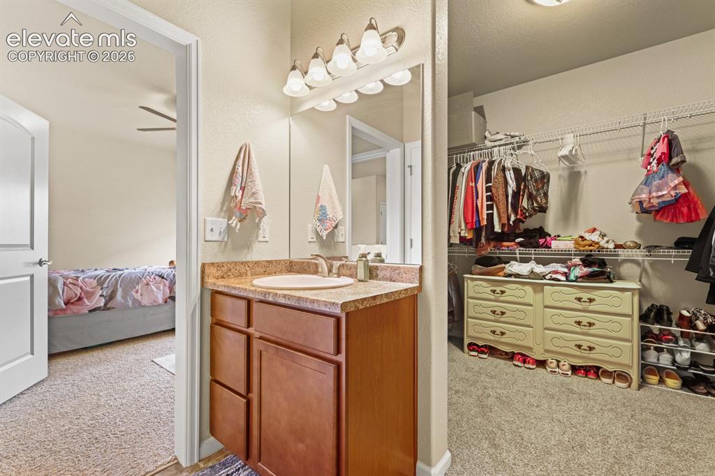 Image 19 of 38: Walk in closet in the Primary Bedroom