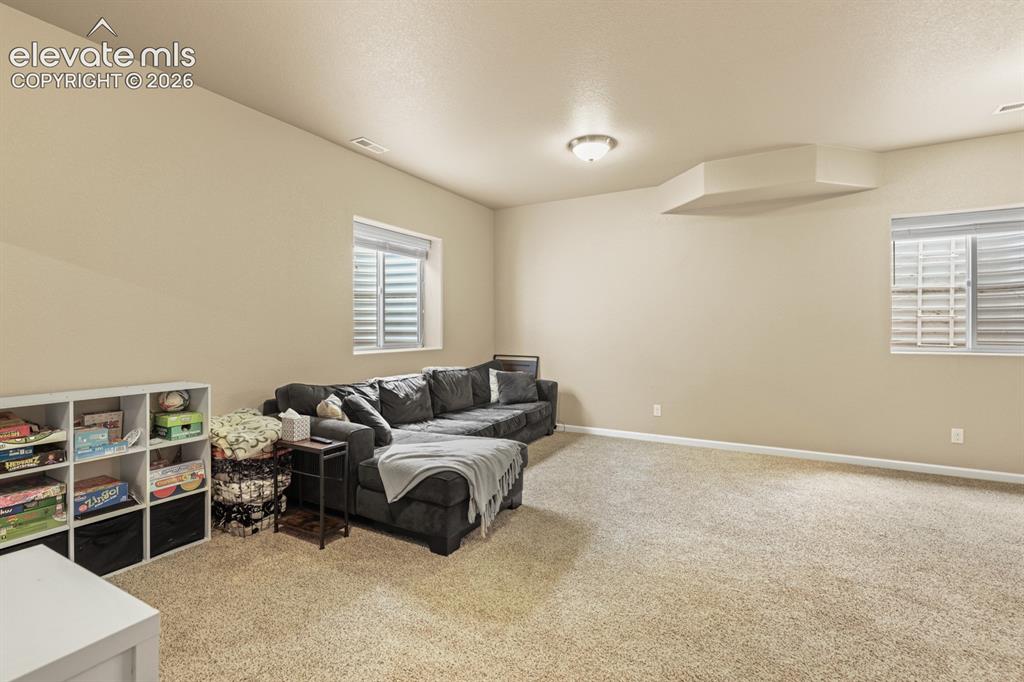 Image 22 of 38: Basement Family Rec Room ideal for entertaining, gaming, or a home theater