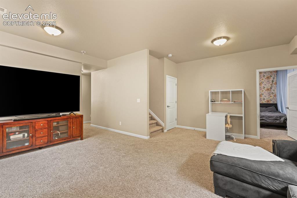 Image 23 of 38: Basement Family Rec Room.