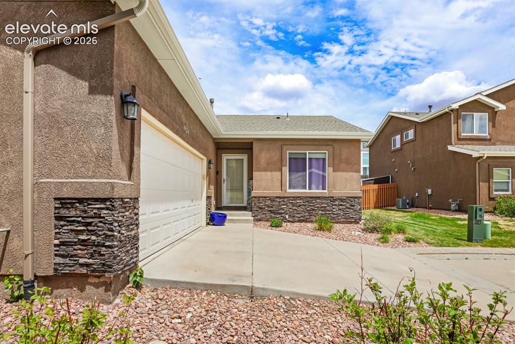 Image 3 of 38: Low maintenance xeriscaped landscaping.