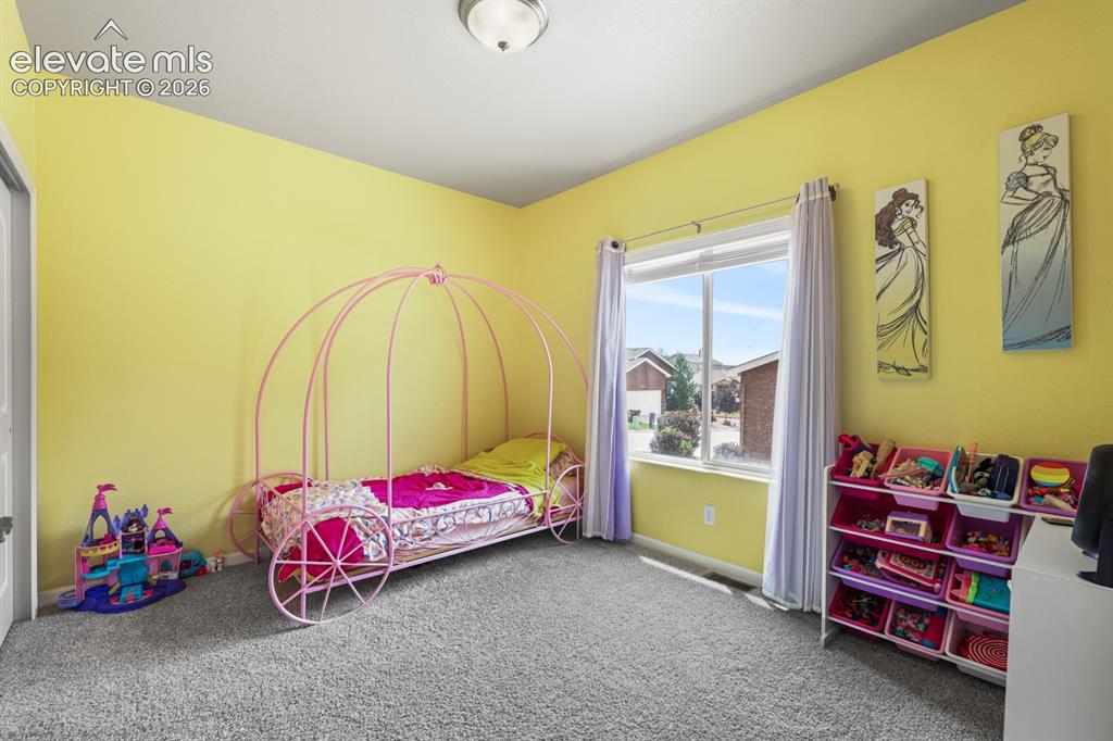 Image 5 of 38: Main-level bedroom with French doors provides the perfect option for a home