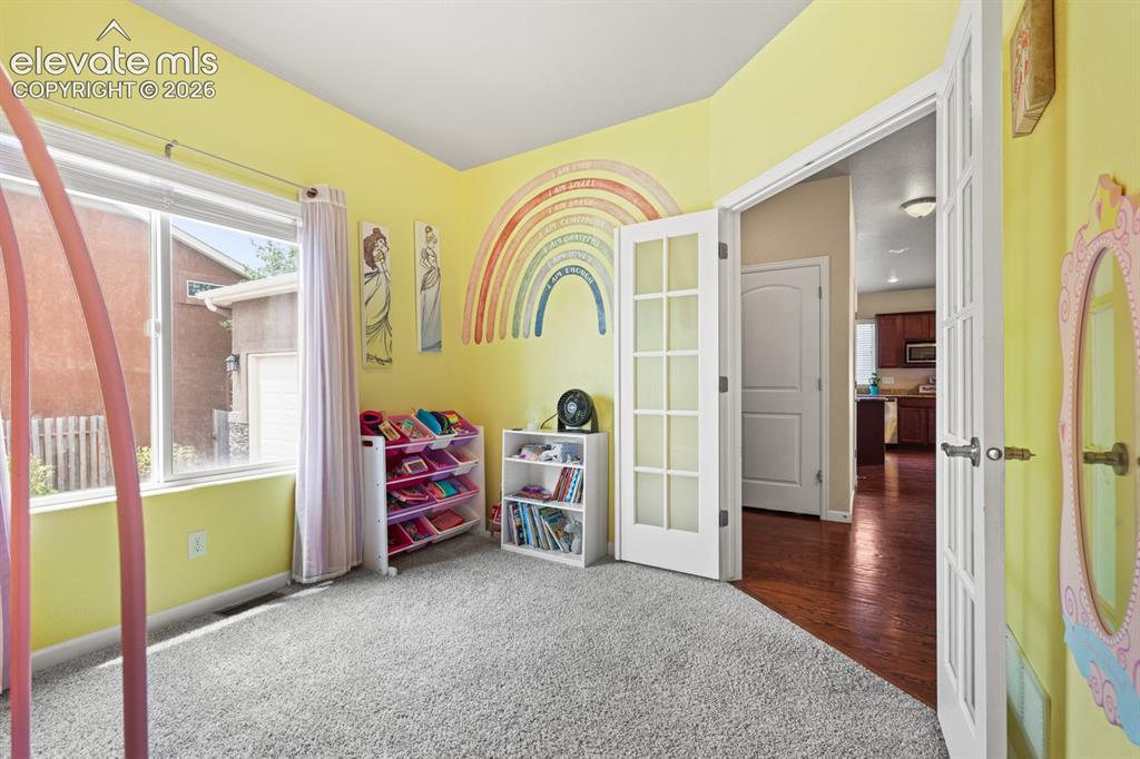 Image 6 of 38: Main Level Bedroom off the Entry, could also be used as a home office.