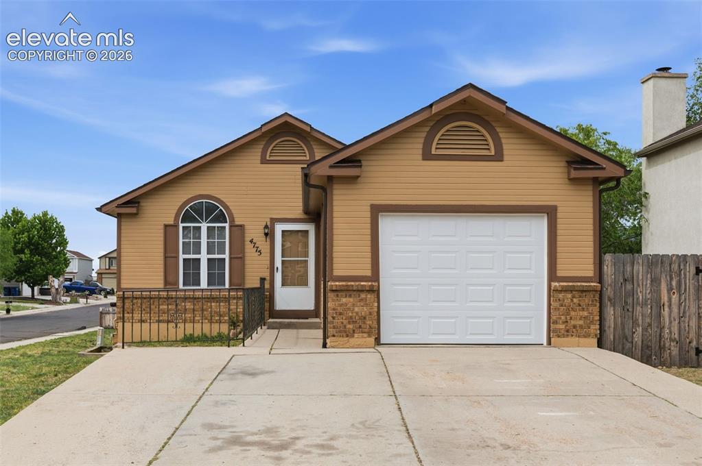 Image 1 of 29: Single-story residence featuring light brown siding and dark brown trim det