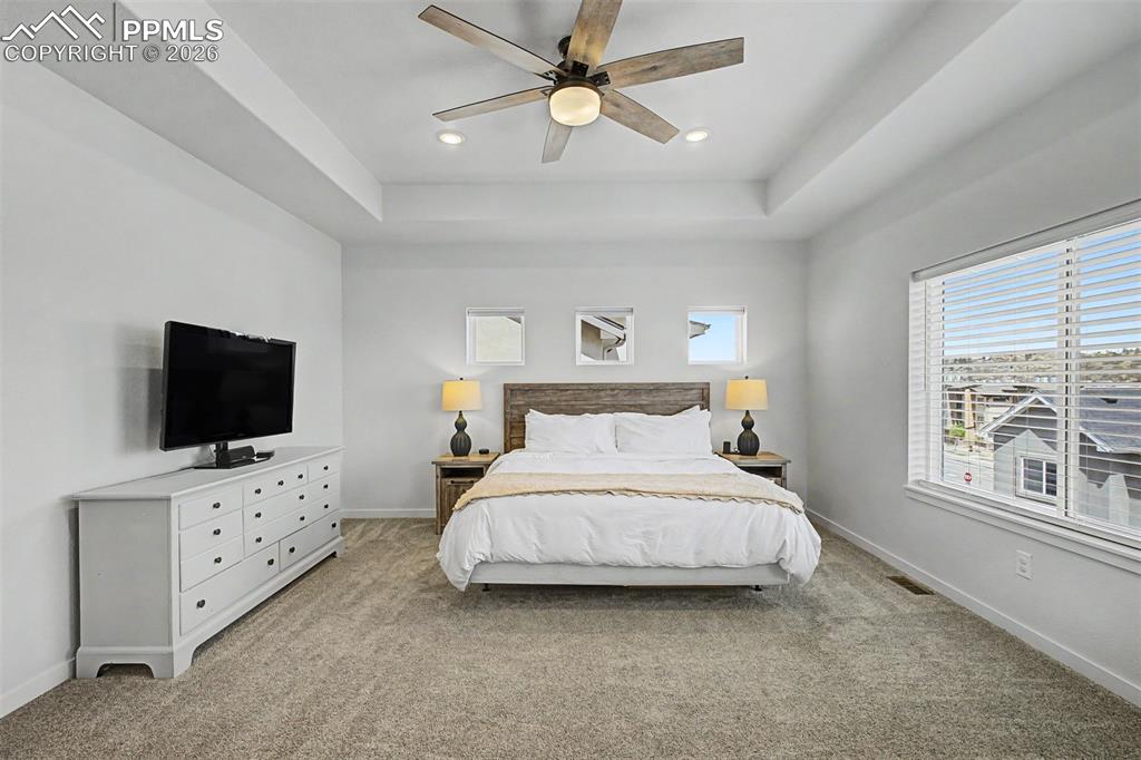 Image 18 of 39: The primary suite reveals just how generously sized this room truly is, wit