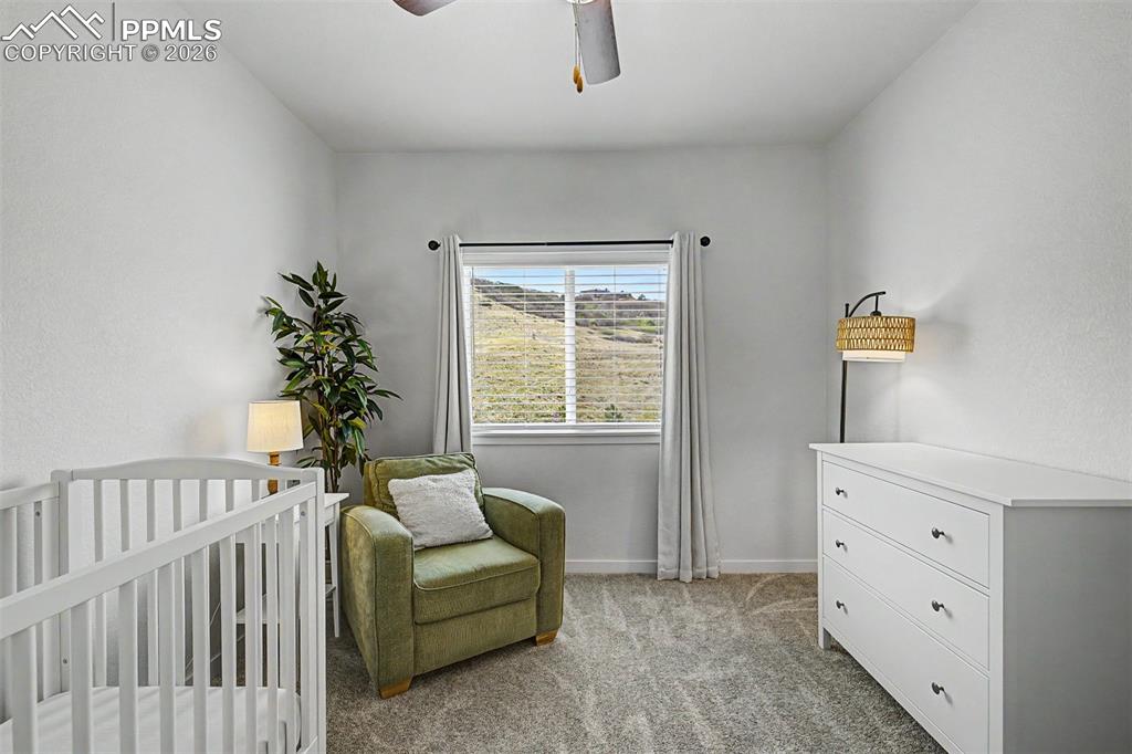 Image 26 of 39: Soft and sweet, this bedroom has been lovingly set up as a nursery, with a