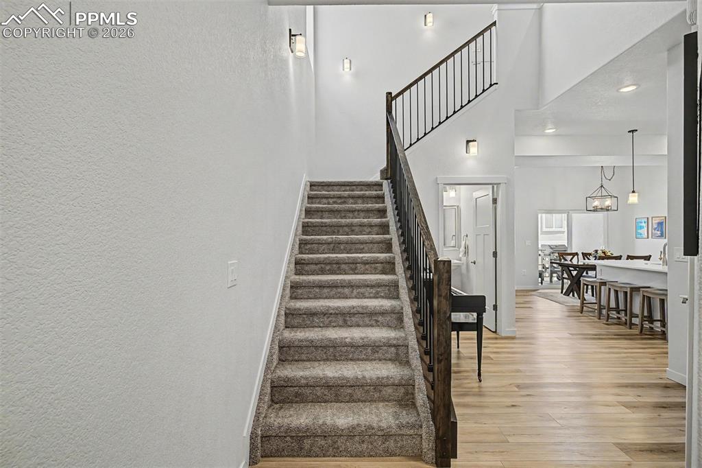 Image 4 of 39: The grand staircase sets the tone for the home