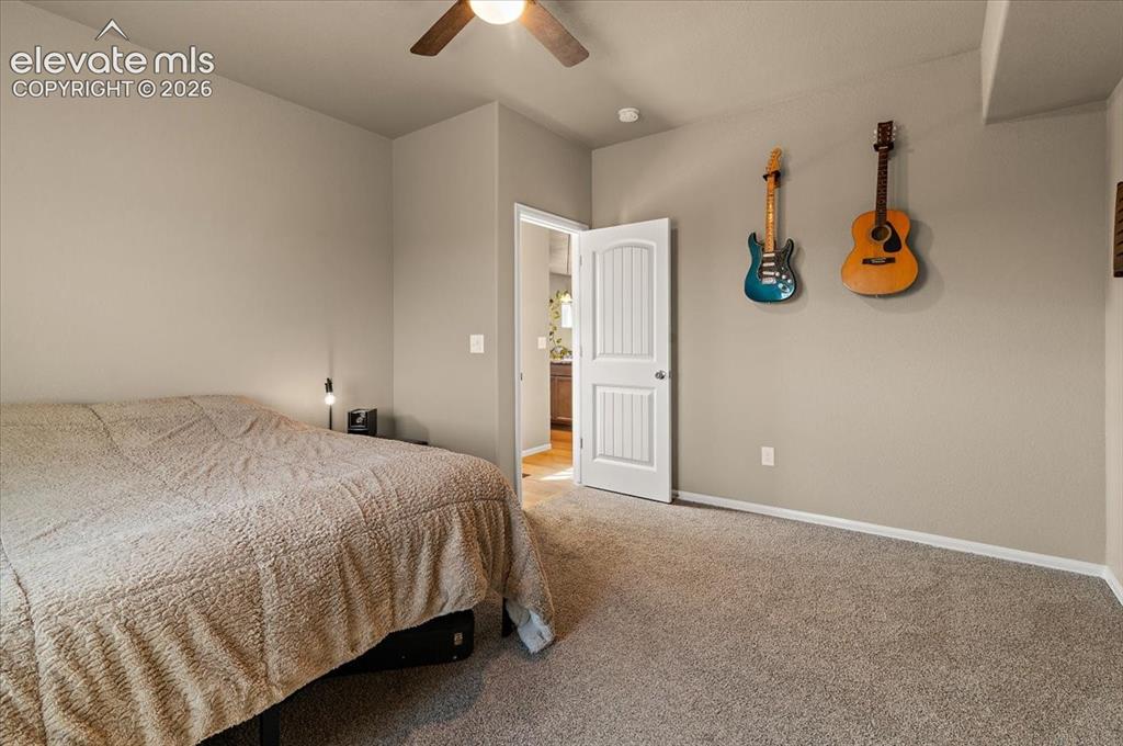 Image 15 of 36: Wall-to-wall carpeting with neutral wall tones and a ceiling fan