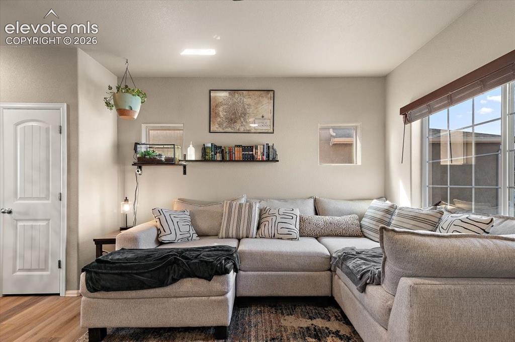 Image 6 of 36: Floor-to-ceiling window with natural light, complementing light-toned walls