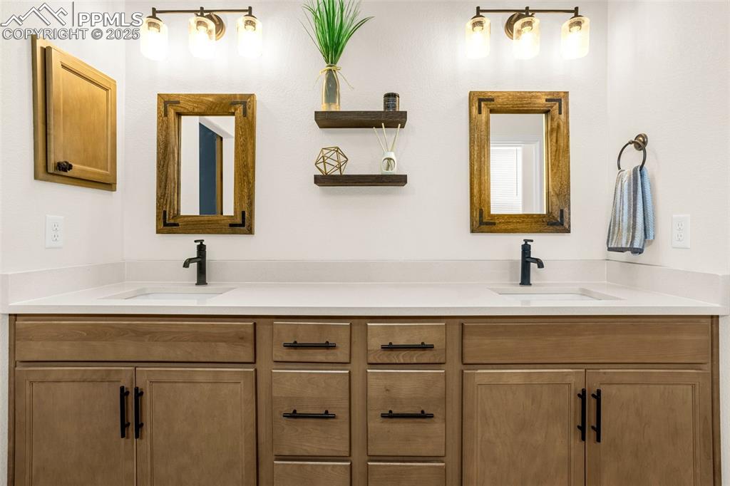 Image 21 of 41: Bathroom featuring double vanity