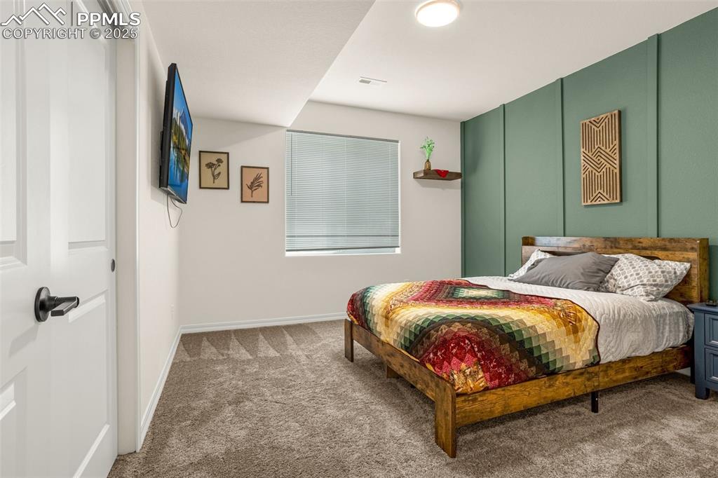 Image 28 of 41: Carpeted bedroom with baseboards
