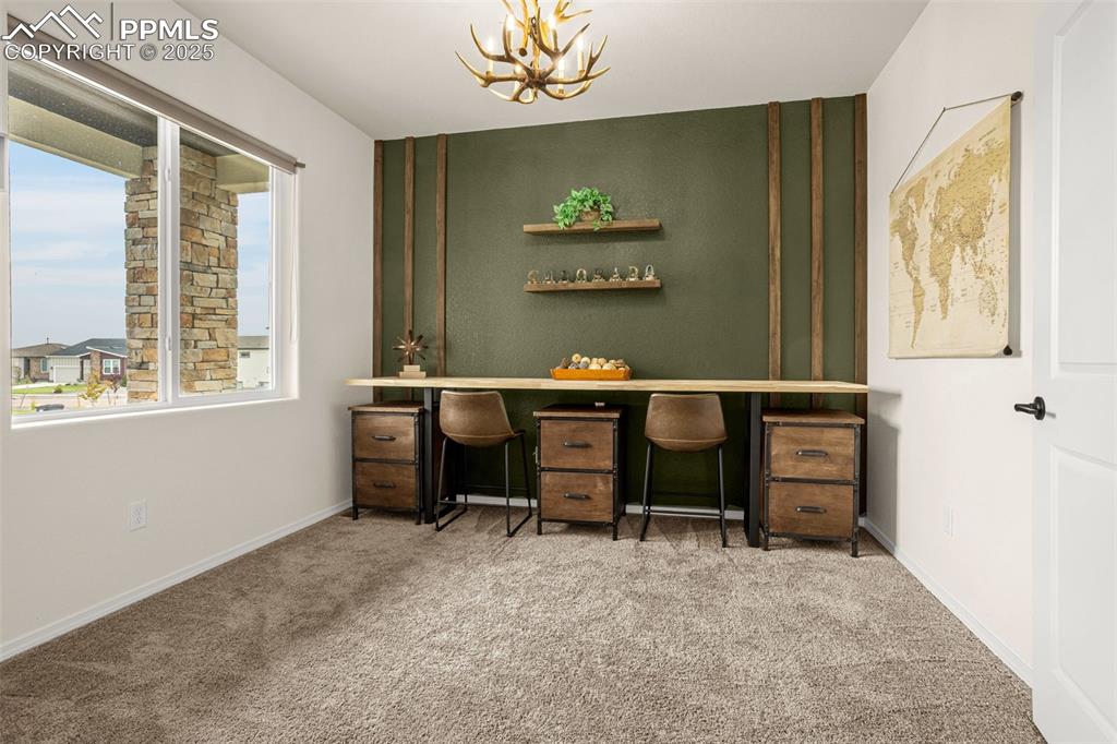 Image 3 of 41: Carpeted office featuring a chandelier and baseboards